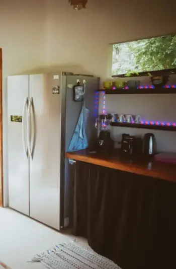 kitchen with appliances inside a cabin