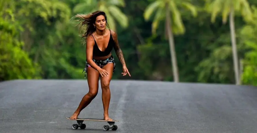 woman skating in street, costa rica